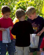 Alex, Casey, and Sam admire their bugs