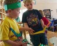 Sam helps Timothy read his card