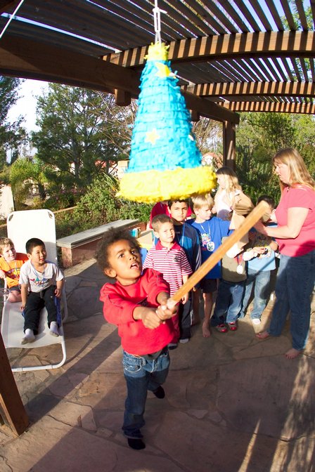 Tayo swings at the pinata