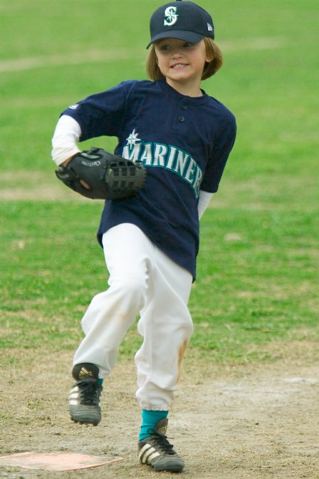 Alana goes into her windup...at first base