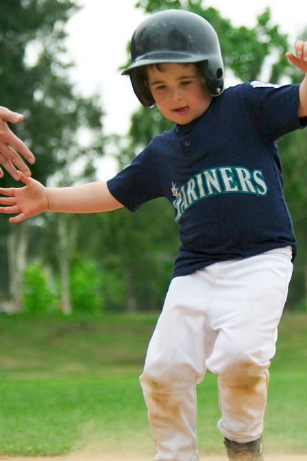 Noah heads for a slide as he comes home