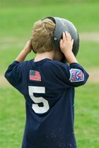 Timothy puts his helmet on