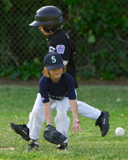 Alana waits impatiently for a late throw at first