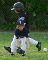 Alana waits impatiently for a late throw at first