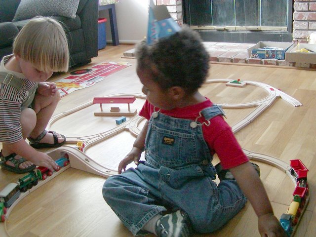 Casey and Miles play with Brio trains