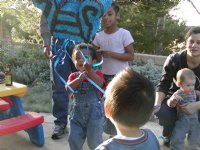 Miles pulls at the piñata