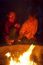 Roasting marshmallows and eating s'mores