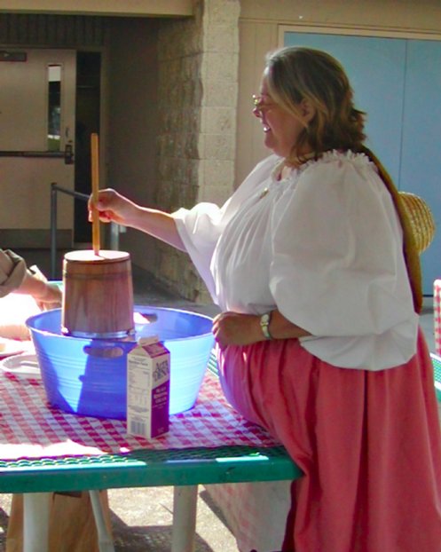 Anna churns butter