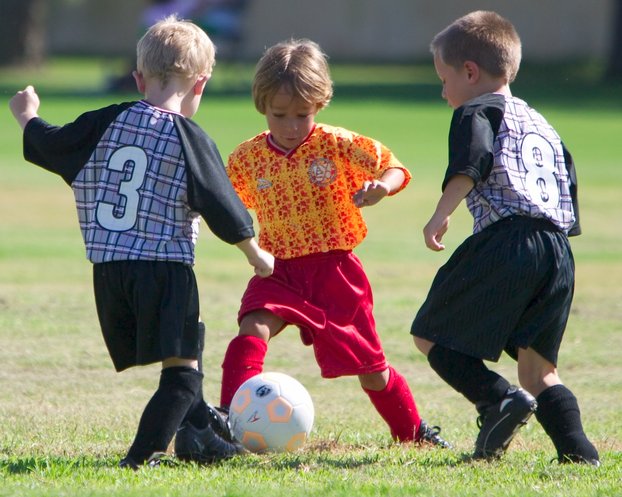 Adam splits two defenders
