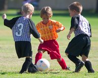 Adam splits two defenders