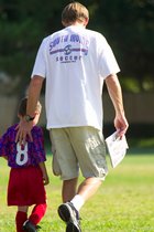 An injured Spiderman walks off the field