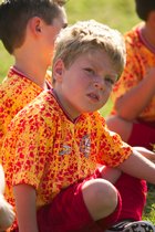 Timothy sits on the field at halftime
